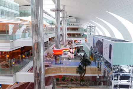 DUBAI, UAE - JUNE 04, 2014: Dubai international Airport interior. Dubai International Airport is the primary airport serving Dubai, United Arab Emirates and is the world's busiest airport by international passenger traffic.のeditorial素材