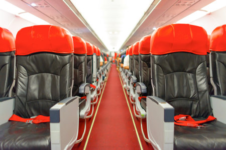 KUALA LUMPUR, MALAYSIA - MAY 02, 2014: AirAsia Airbus A320-200 interior. AirAsia Berhad is a Malaysian low-cost airline headquartered near Kuala Lumpur, Malaysiaのeditorial素材