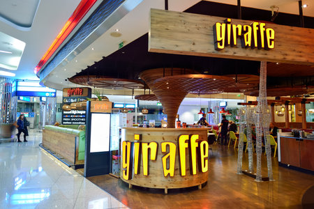 DUBAI, UAE - SEPTEMBER 08, 2015: Jiraffe cafe in Dubai Airport. There are a lot of restaurants, bars, cafes and shops in Dubai International Airport. Almost all of them are open twenty-four hours.のeditorial素材