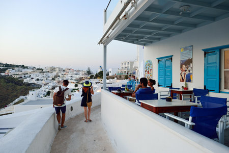 SANTORINI, GREECE - AUGUST 07, 2015: open air restaurant on Santorini island. The traditional architecture of Santorini is similar to that of the other Cyclades, with low-lying cubical housesのeditorial素材