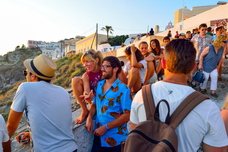 SANTORINI, GREECE - AUGUST 07, 2015: people meet sunset on Santorini island. Santorini, classically...