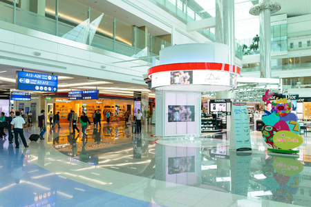 DUBAI, UAE - APRIL 18, 2014: the interior of Concourse A. The concourse includes one 4 star hotel and one 5 star hotel, first and business class lounges, and duty-free areasのeditorial素材