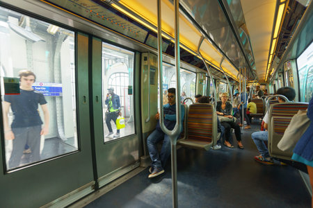 PARIS - SEPTEMBER 10, 2014: passengers in Paris Metropolitain train. The Paris Metro or Metropolitain is a rapid transit system in the Paris Metropolitan Areaのeditorial素材