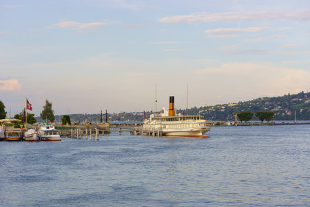 GENEVA, SWITZERLAND - SEPTEMBER 14, 2014: CGN paddle steamer. Lake Geneva General Navigation Company is a public Swiss company operating boats on Lake Geneva connecting towns in both France and Switzerlandのeditorial素材