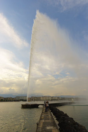 GENEVA, SWITZERLAND - SEPTEMBER 14, 2014: Jet d'Eau at day. The Jet d'Eau is a large fountain in Geneva, Switzerland, and is one of the city's most famous landmarksのeditorial素材