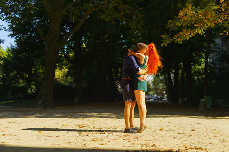 Beauty young couple walking in the park in Paris downtown.の写真素材