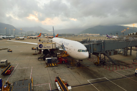 HONG KONG - NOVEMBER 16, 2015: jet flight docked in Hong Kong Airport. Hong Kong International Airport is the main airport in Hong Kong. It is located on the island of Chek Lap Kokのeditorial素材