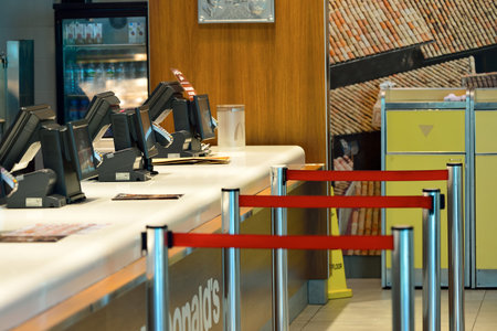 DUBAI, UAE - NOVEMBER 16, 2015: interior of McDonald's restaurant in Dubai Airport. Dubai International Airport is the world's busiest airport by international passenger traffic.のeditorial素材