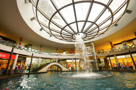 SINGAPORE - NOVEMBER 08, 2015: view on Rain Oculus. Rain Oculus is a large whirlpool forms inside a 70 foot diameter acrylic bowl and falls 2 stories to a pool belowのeditorial素材