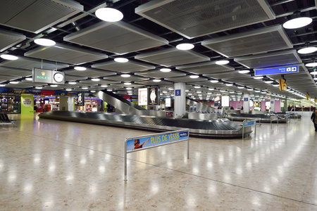 GENEVA, SWITZERLAND - NOVEMBER 18, 2015: Baggage claim area in Geneva Airport. Geneva International Airport is the international airport of Geneva, Switzerland. It is located 4 km northwest of the city centre.のeditorial素材