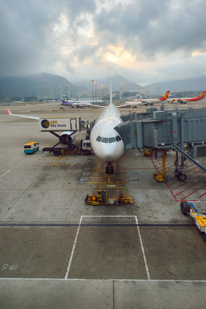 HONG KONG - NOVEMBER 16, 2015: jet flight docked in Hong Kong Airport. Hong Kong International...