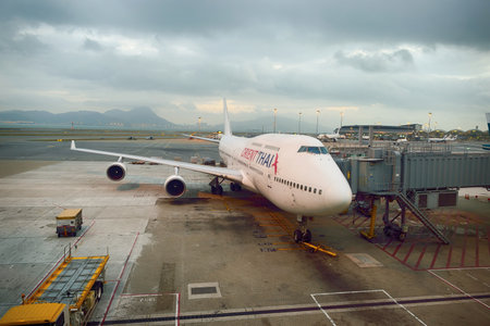 HONG KONG - NOVEMBER 16, 2015: jet flight docked in Hong Kong Airport. Hong Kong International...