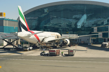 DUBAI, UAE - NOVEMBER 16, 2015: Boeing 777-300 docked in Dubai airport. Dubai International Airport is an international airport serving Dubai. It is a major airline hub in the Middle East, and is the main airport of Dubai.のeditorial素材