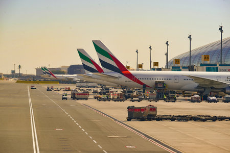DUBAI, UAE - NOVEMBER 16, 2015: Boeing 777-300 docked in Dubai airport. Dubai International Airport is an international airport serving Dubai. It is a major airline hub in the Middle East, and is the main airport of Dubai.のeditorial素材