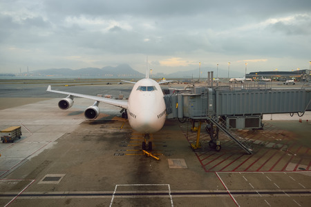 HONG KONG - NOVEMBER 16, 2015: jet flight docked in Hong Kong Airport. Hong Kong International...