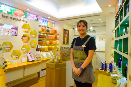 HONG KONG - NOVEMBER 02, 2015: seller of the cosmetics store in New Town Plaza. New Town Plaza is a shopping mall in the town centre of Sha Tin in Hong Kong. Developed by Sun Hung Kai Propertiesのeditorial素材