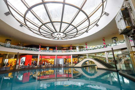 SINGAPORE - NOVEMBER 08, 2015: view on Rain Oculus. Rain Oculus is a large whirlpool forms inside a 70 foot diameter acrylic bowl and falls 2 stories to a pool belowのeditorial素材