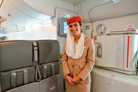 HONG KONG - NOVEMBER 22, 2015: Emirates crew member on board of Airbus A380. Emirates is an airline based in Dubai, United Arab Emirates. It is the largest airline in the Middle East.のeditorial素材