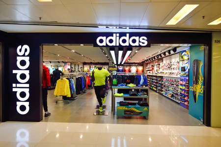 HONG KONG - NOVEMBER 02, 2015: an Adidas shop in New Town Plaza. Adidas AG is a German multinational corporation that designs and manufactures sports shoes, clothing and accessoriesのeditorial素材