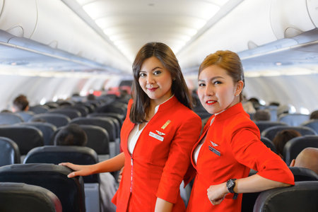 SINGAPORE - NOVEMBER 04, 2015: AirAsia crew member on board of Airbus A320. AirAsia is a Malaysian low-cost airline headquartered near Kuala Lumpur, Malaysiaのeditorial素材
