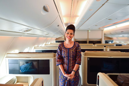 SINGAPORE - NOVEMBER 03, 2015: Singapore Airlines crew member on board of Airbus A380. Singapore...