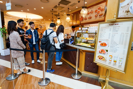 SINGAPORE - NOVEMBER 08, 2015: customers in the cafe in The Shoppes at Marina Bay Sands. The Shoppes...