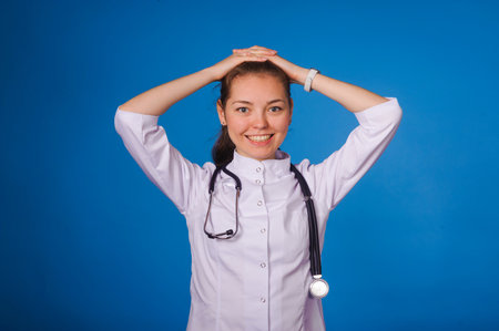 Studio portrait of young intern against blue backgoundの写真素材