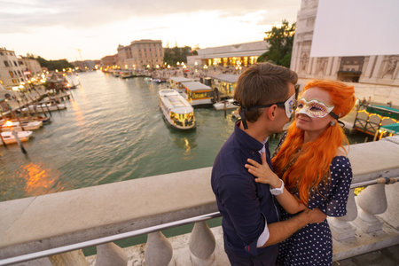 Young couple dating on the bridge in center of Venice.の写真素材