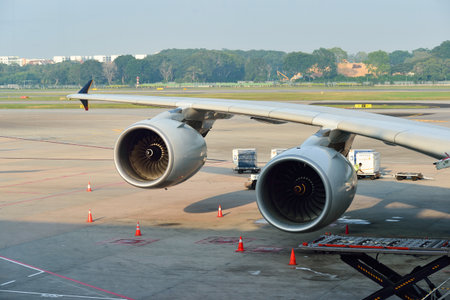 SINGAPORE - NOVEMBER 10, 2015: wing of Airbus A380 docked at Changi Airport. Singapore Changi Airport, is the primary civilian airport for Singapore, and one of the largest transportation hubs in Southeast Asiaのeditorial素材