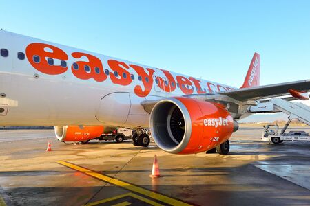 GENEVA, SWITZERLAND - NOVEMBER 18, 2015: easyJet aircraft at Geneva Airport. EasyJet is a British low-cost airline carrier, owing to its all-economy class fleetのeditorial素材