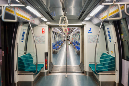 SINGAPORE - NOVEMBER 08, 2015: interior of MRT train. The Mass Rapid Transit, or MRT, is a rapid transit system forming the major component of the railway system in Singapore, spanning the entire city-stateのeditorial素材