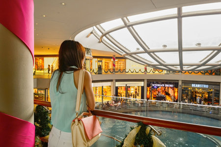 SINGAPORE - NOVEMBER 08, 2015: view on Rain Oculus. Rain Oculus is a large whirlpool forms inside a 70 foot diameter acrylic bowl and falls 2 stories to a pool belowのeditorial素材