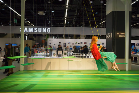 COLOGNE, GERMANY - SEPTEMBER 19, 2014: Samsung stand at the Photokina Exhibition. The Photokina is the world's largest trade fair for the photographic and imaging industriesのeditorial素材