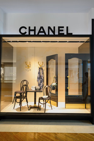 SINGAPORE - NOVEMBER 08, 2015: shop window of Chanel store. Chanel S.A. is a high fashion house that specializes in haute couture and ready-to-wear clothes, luxury goods and fashion accessoriesのeditorial素材