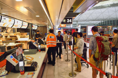 HONG KONG - NOVEMBER 16, 2015: people in the McDonald's restaurant. McDonald's primarily sells...