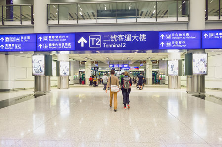 HONG KONG - NOVEMBER 15, 2015: passengers in Hong Kong Airport. Hong Kong International Airport is the main airport in Hong Kong.のeditorial素材