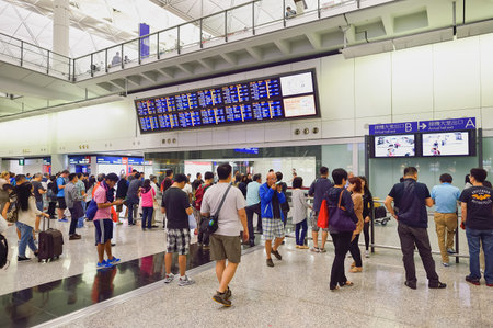 HONG KONG - NOVEMBER 15, 2015: passengers in Hong Kong Airport. Hong Kong International Airport is the main airport in Hong Kong.のeditorial素材