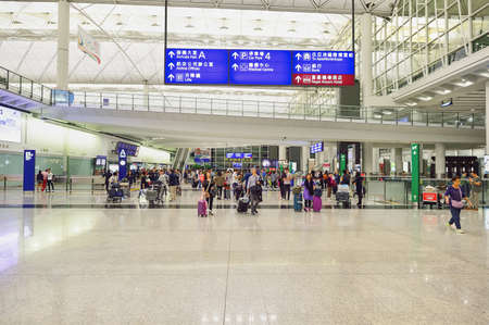HONG KONG - NOVEMBER 15, 2015: passengers in Hong Kong Airport. Hong Kong International Airport is the main airport in Hong Kong.のeditorial素材