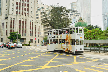 HONG KONG - MAY 06, 2015: Hong Kong double-decker tram in Central. Trams in Hong Kong is the cheapest mode of public transport on the islandのeditorial素材