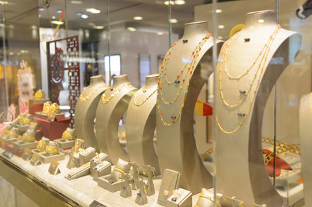 HONG KONG - APRIL 14, 2015: New Town Plaza jewelry store interior. New Town Plaza is a shopping mall in the town centre of Sha Tin in Hong Kong. Developed by Sun Hung Kai Properties.のeditorial素材
