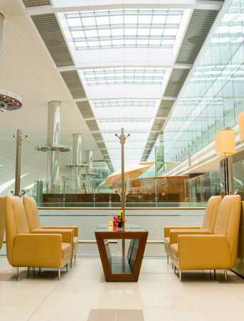 DUBAI, UAE - APRIL 18, 2014: business class lounge interior. Dubai International Airport is an international airport serving Dubai. It is a major airline hub in the Middle East, and is the main airport of Dubai.のeditorial素材