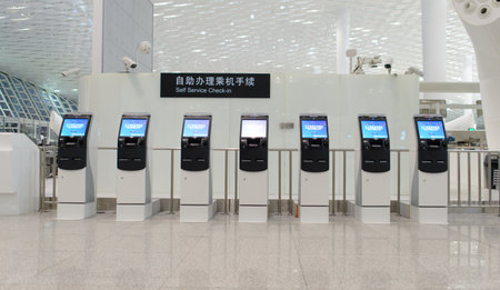 SHENZHEN - APRIL 16: self check-in kiosks on April 16, 2014 in Shenzhen, China. Shenzhen Bao'an International Airport is located near Huangtian and Fuyong villages in Bao'an District, Shenzhen, Guangdongのeditorial素材