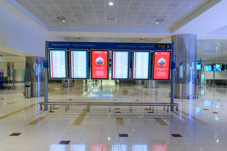 DUBAI, UAE - APRIL 18, 2014: airport interior. Dubai International Airport is an international airport serving Dubai. It is a major airline hub in the Middle East, and is the main airport of Dubai.のeditorial素材