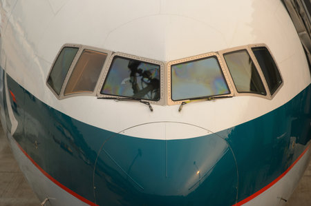 HONG KONG - MARCH, 09, 2015: Cathay Pacific aircraft near boarding bridge. Cathay Pacific is the flag carrier of Hong Kong, with its head office and main hub located at Hong Kong International Airport.のeditorial素材