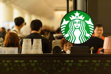 HONG KONG - MARCH 09, 2015: airport Starbucks cafe. Starbucks is the largest coffeehouse company in the world, with more then 23000 storesのeditorial素材