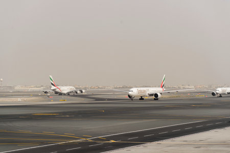DUBAI, UAE - MARCH 10, 2015: jet aircraft in Dubai airport. Dubai International Airport is an international airport serving Dubai. It is a major airline hub in the Middle East, and is the main airport of Dubai.のeditorial素材