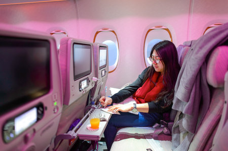 HONG KONG - MARCH 09, 2015: Emirates Airbus A380 economy class passenger. Emirates handles major part of passenger traffic and aircraft movements at the airport.のeditorial素材