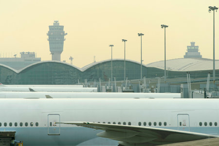 HONG KONG - MARCH, 09, 2015: Cathay Pacific aircraft near boarding bridge. Cathay Pacific is the...