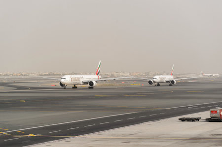 DUBAI, UAE - MARCH 10, 2015: jet aircraft in Dubai airport. Dubai International Airport is an international airport serving Dubai. It is a major airline hub in the Middle East, and is the main airport of Dubai.のeditorial素材