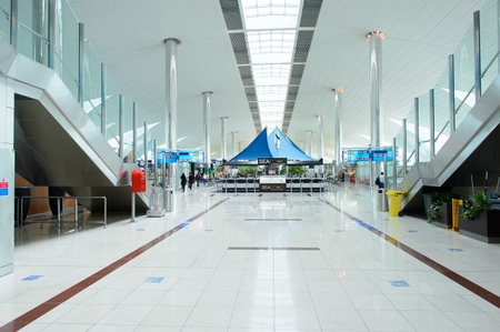 DUBAI, UAE - MARCH 10, 2015: DXB airport interior. Dubai International Airport is an international airport serving Dubai. It is a major airline hub in the Middle East, and is the main airport of Dubai.のeditorial素材